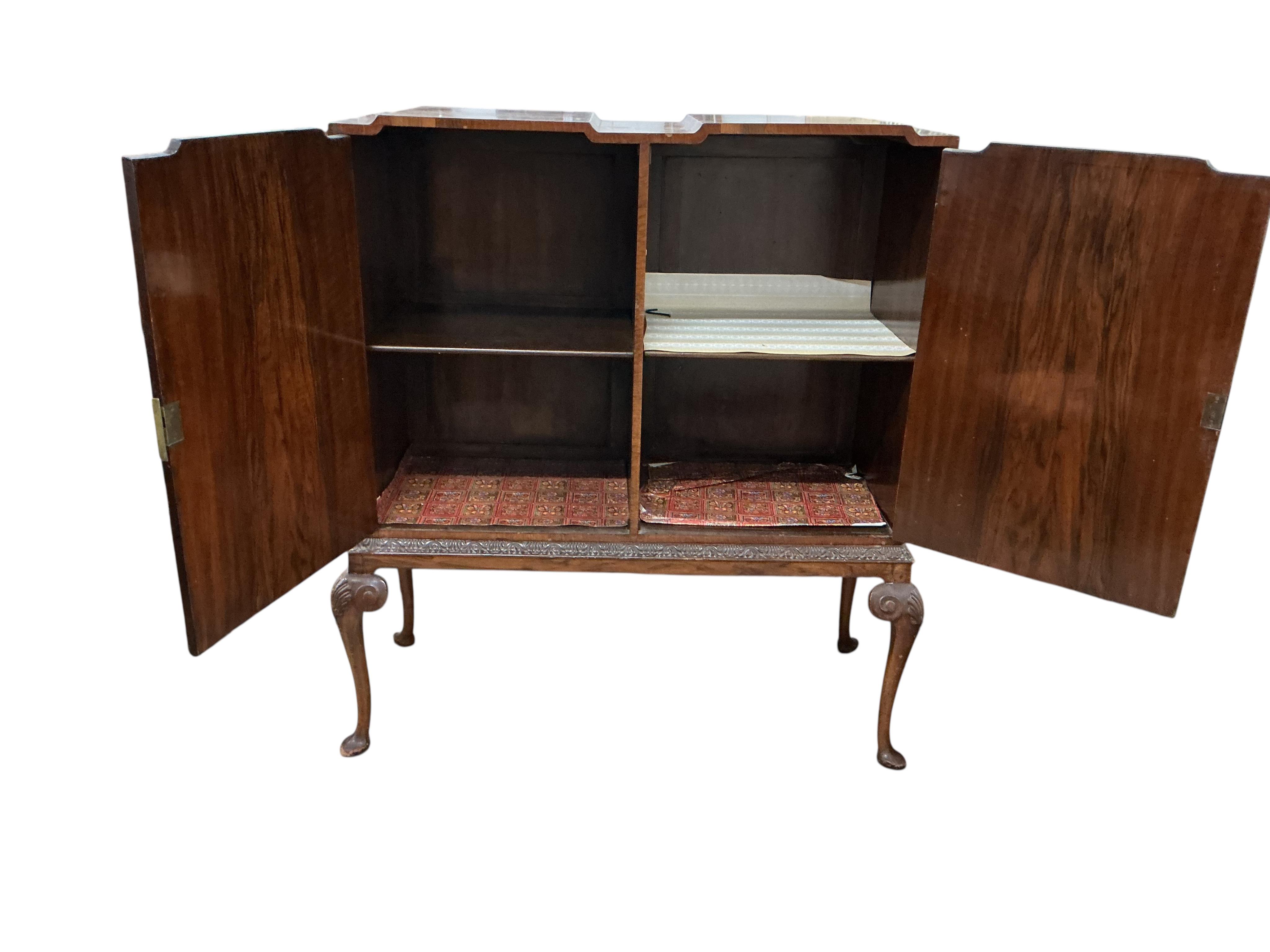 A Queen Anne Revival walnut side cabinet, width 128cm, depth 56cm, height 140cm